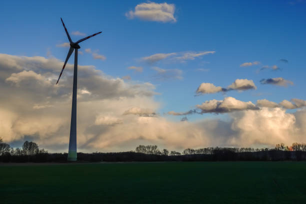 istock windmill for clean energy and rain clouds on blue sky 1482335001