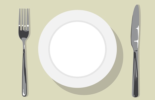 Top view of white empty plate and on each side of the plate is fork and knife
