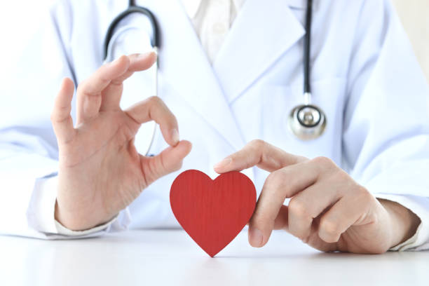 istock Doctor with OK gesture and red heart object 1482339652
