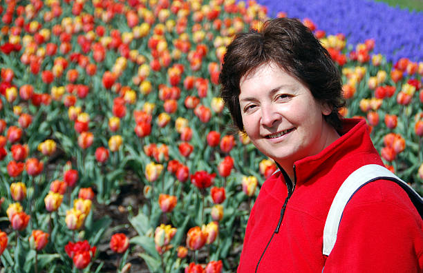 Adult woman and tulips stock photo