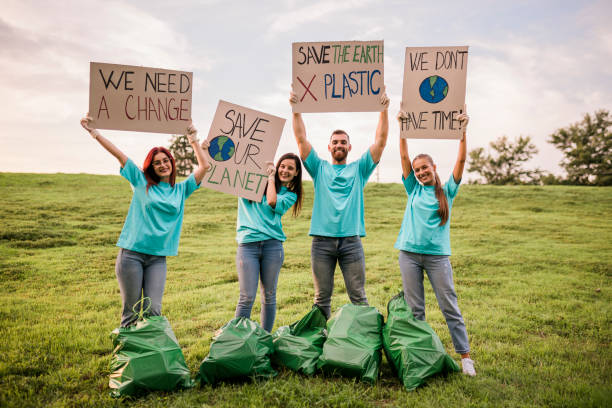 istock People are holding banner signs while they are going to a demonstration against climate change. Protest against global warming. Climate change protest concept. 1482342090