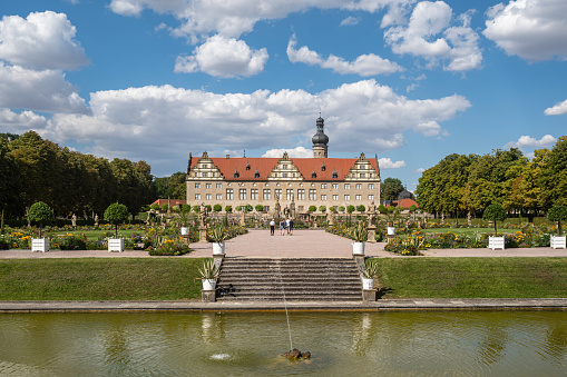 View of Weikersheim Palace (Schloss Weikersheim), surrounded by a beautiful park and located on the famous Romantic Road. Weikersheim, Germany, Aug. 2022