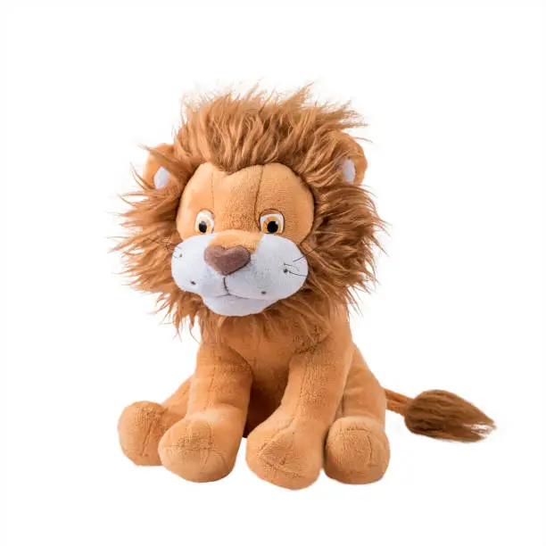 cuddly soft children's toy lion on white background. copy space.