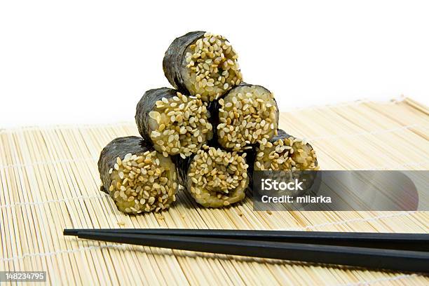 Japanese Rolls With Sesame And Sticks Stock Photo - Download Image Now - Appetizer, Black Color, Chopsticks