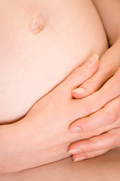 istock Pregnant woman belly and hands 148234932