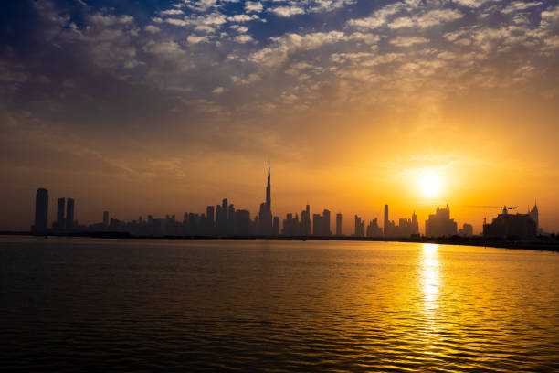 istock Dubai skyline during sunset. Dubai's skyline cast long shadows, creating a stunning silhouette against the evening sky. 1482353372