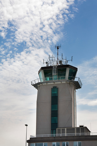 A Coruña, Spain_ May 12, 2012: Control tower of La Coruña airport, cloudscape background.