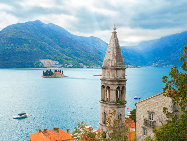 Historic city of Perast Historic city of Perast in Montenegro. View of the tower, the Bay of Kotor and the island of St. George montenegro stock pictures, royalty-free photos & images