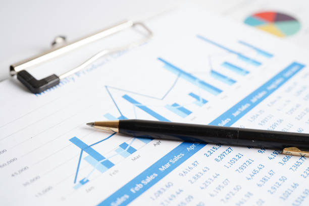 istock Pen on chart or graph paper. Financial, account, statistics and business data concept. 1482361363