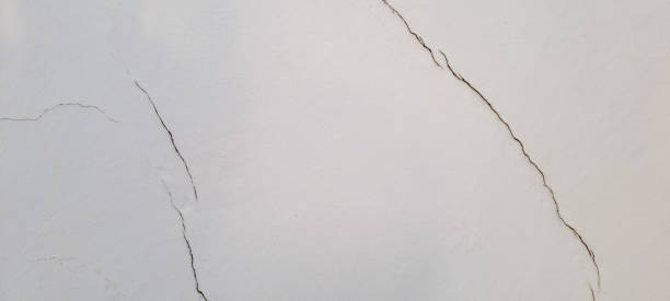 istock Crack at a corner of a white wall 1482361395
