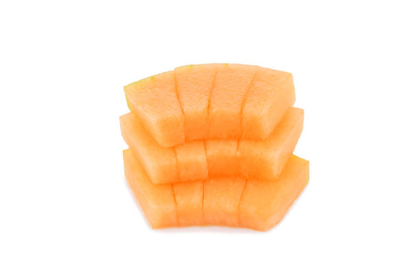 Slices of cantaloupe melon isolated on white background