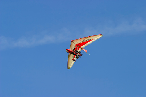 Falköping, Sweden-June, 2020: Ultralight trike flying in the sky