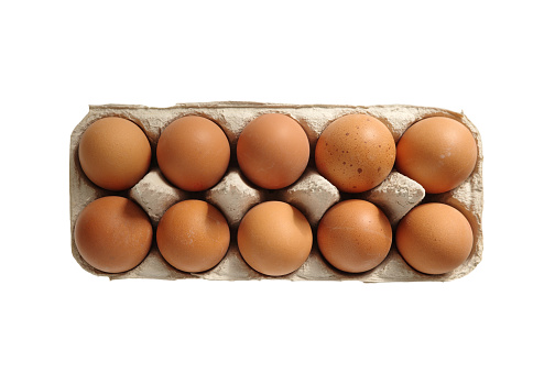 Brown eggs in a cardboard box high angle view isolated on white