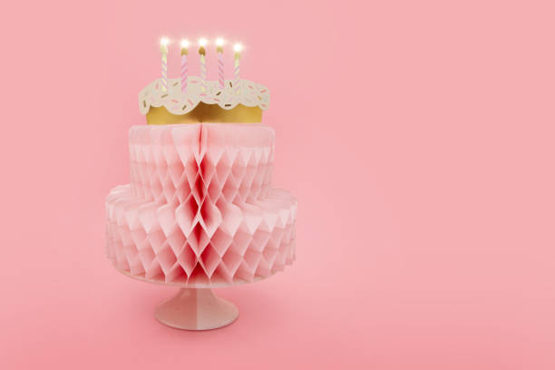 istock Banner birthday cake with candles. Isolated on pink pastel background 1482364531