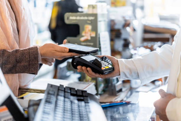 istock Customer making contactless payment through smart phone at pharmacy 1482365811