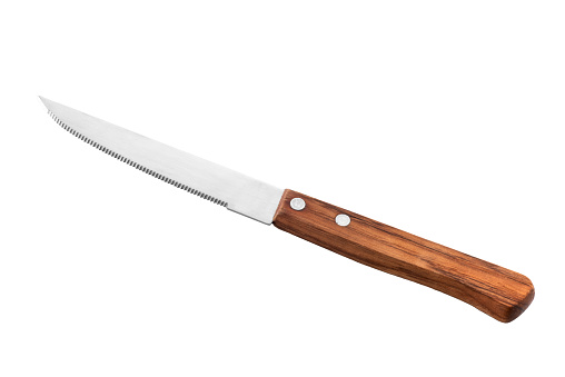 Serrated table knife with wooden handle isolated on white, clipping path included