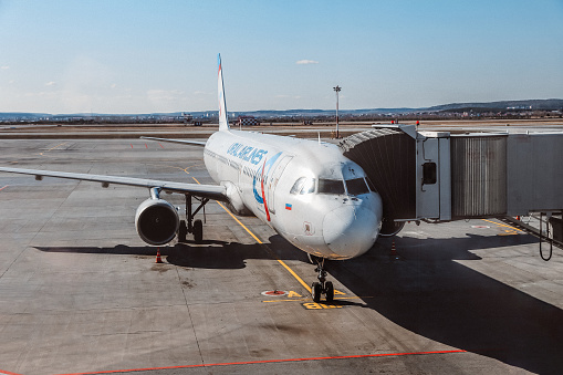 Lisbon, Portugal: Boeing 737 NG (Next Generation) - Turkish Airlines Boeing-737-800, receiving luggage, jet bridge at Terminal 1,  Lisbon Airport / Humberto Delgado Airport / Portela Airport  (IATA: LIS, ICAO: LPPT) - TK Boeing 737-8F2(WL), registration TC-JHN