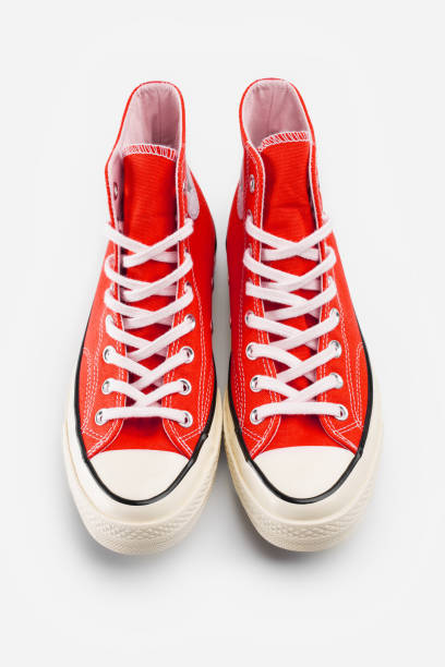 istock Red sneakers on white background with copy space. Youth shoes. 1482371775