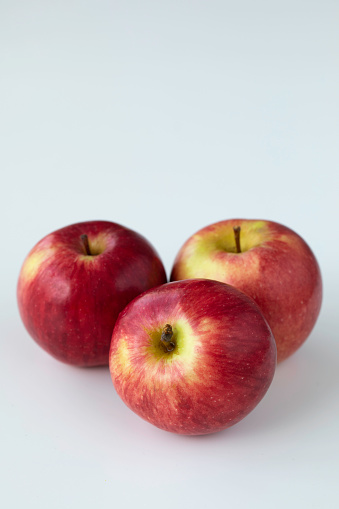 Red apples on a white background.