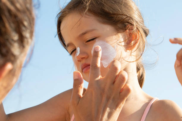istock Mother Applying Sun Cream on Daughter's Face 1482372247