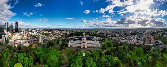 Melbourne, Australia – March 07, 2023: The vibrant cityscape with the Royal Exhibition Building in the foreground. Carlton, Australia.