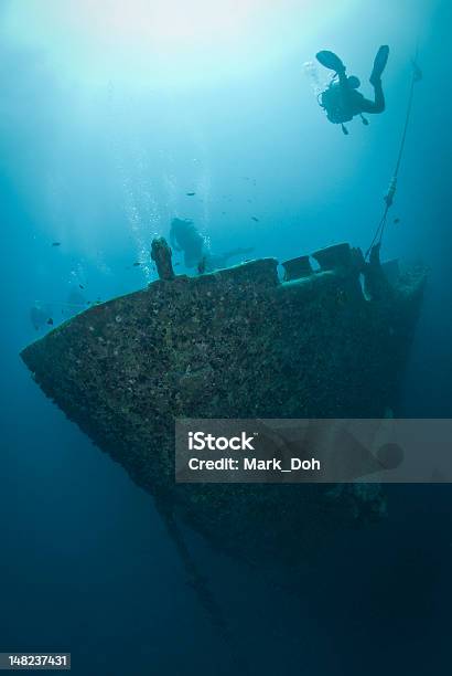 Silhouettes Of Scuba Divers Exploring A Shipwreck Stock Photo - Download Image Now - Undersea, Red Sea, Rusty