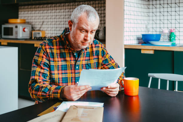 istock Worried man checking bills at home 1482377347