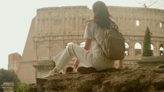 Tourist woman in Rome by the Coliseum