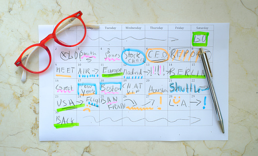 Calendar with business appointments,pen and spectacles, monthly schedule