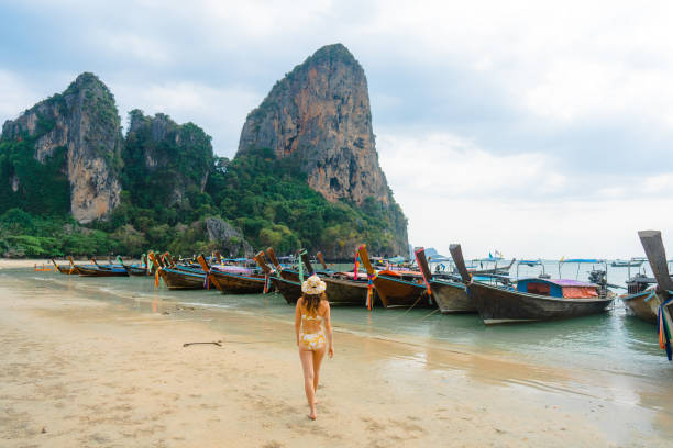 istock Cheerful woman on Railey beach in Krabi 1482384905