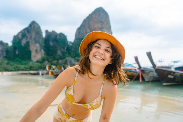 istock Cheerful woman on Railey beach in Krabi 1482384929