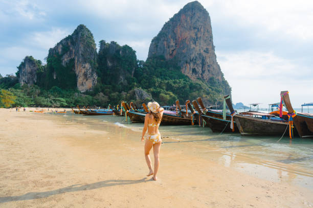 istock Cheerful woman on Railey beach in Krabi 1482384930