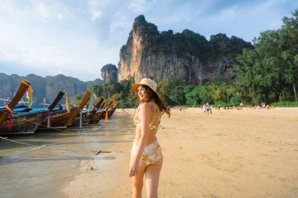 istock Cheerful woman on Railey beach in Krabi 1482385024
