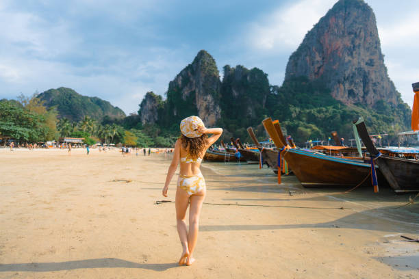 istock Cheerful woman on Railey beach in Krabi 1482385105