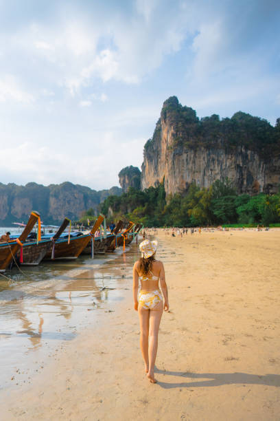 istock Cheerful woman on Railey beach in Krabi 1482385106