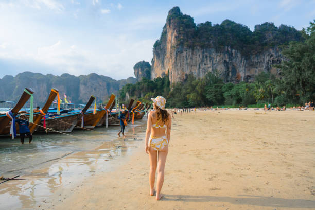 istock Cheerful woman on Railey beach in Krabi 1482385140
