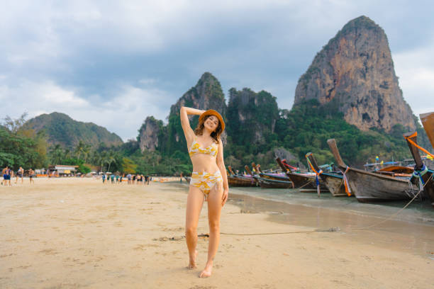 istock Cheerful woman on Railey beach in Krabi 1482385147