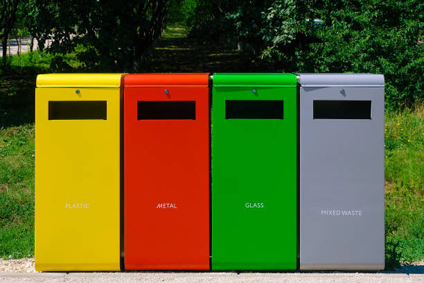 istock Four colored bins for separate garbage. Separate collection of glass, metal, plastic and mixed waste. 1482385155