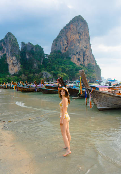 istock Cheerful woman on Railey beach in Krabi 1482385229