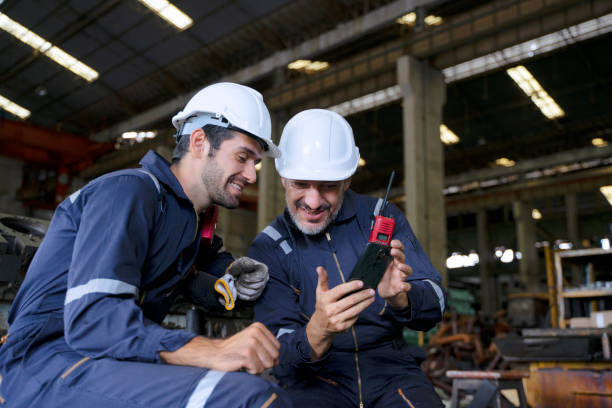 Blue collar worker work at machinery factory. stock photo