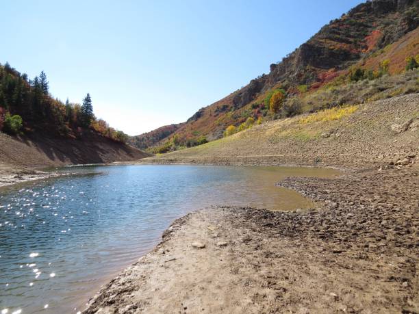istock Scenic view of a riverfront with a mountain backdrop in the fall in Utah 1482387599