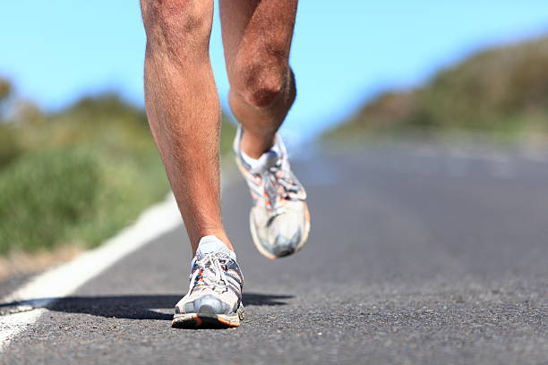 istock Running shoes - runner legs closeup 148239191