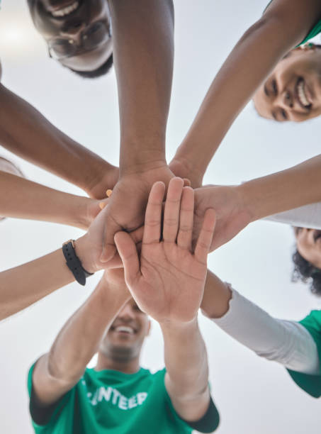 istock Teamwork, volunteer and support with hands of people for sustainability, environment and climate change. Recycling, earth day and charity with friends and stack for diversity, energy and pollution 1482392583
