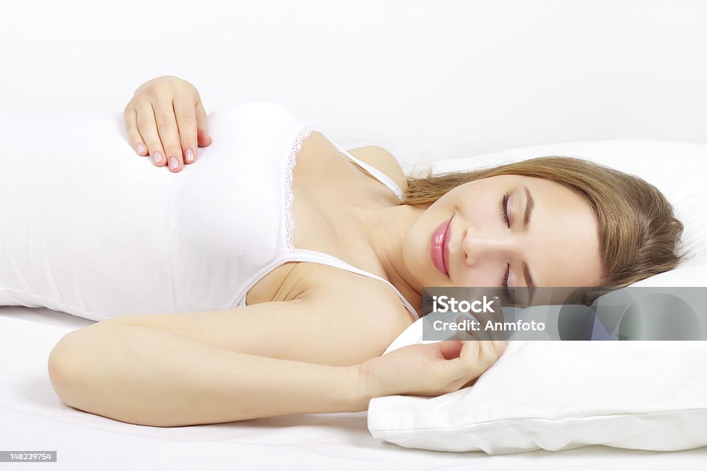 Sleeping Girl on the bed Sleeping Girl on the bed. on light background Sleeping Stock Photo