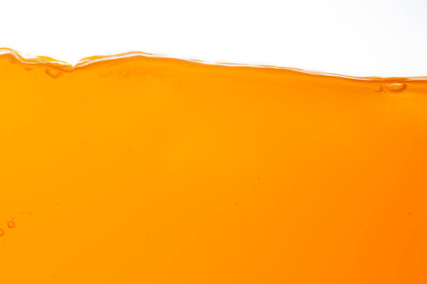 istock Orange juice isolated white background,orange juice texture on white background,Close up bright orange juice texture for health and nature waves 1482397776