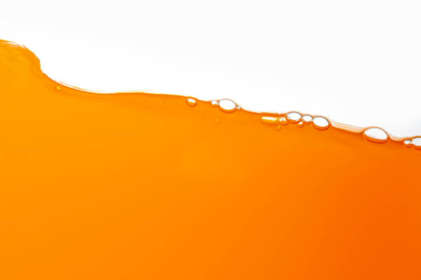 istock Orange juice isolated white background,orange juice texture on white background,Close up bright orange juice texture for health and nature waves 1482397783