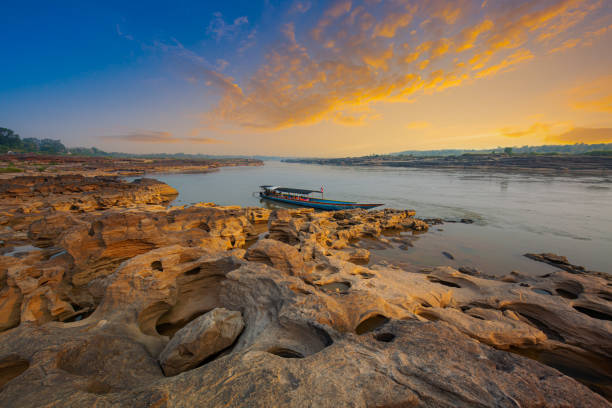 istock Ubon Ratchathani,Sunrise landscape photo with boat, mountain,Sam Phan Bok, Ubon Ratchathani, Thailand 1482398299