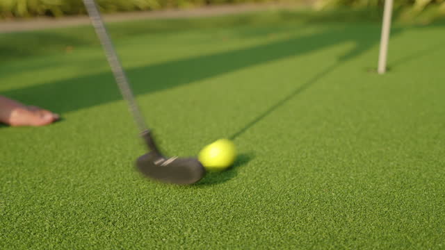Putting golf on artificial turf.