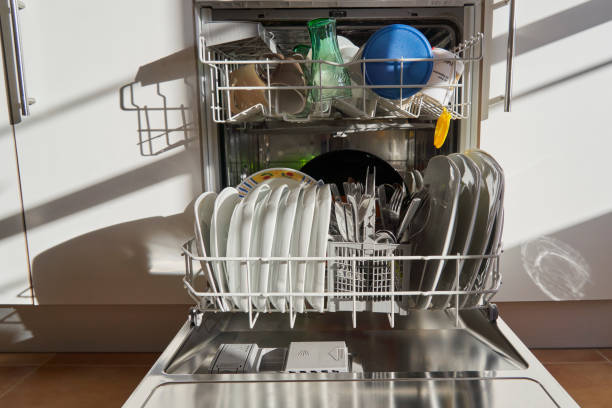 istock Front view of dishes and utensils in a dishwasher 1482401323