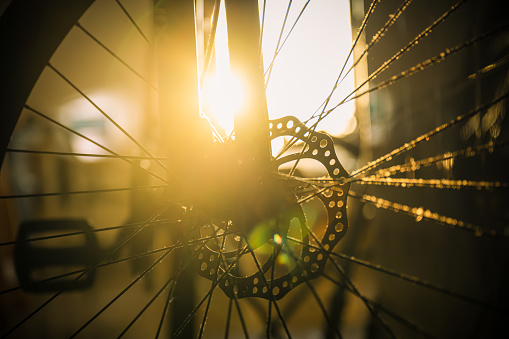 Sunlight shining on bicycle wheels